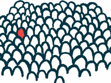 A person, the sole individual in red, stands out in a crowd of people.