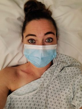 living with CF | Cystic Fibrosis News Today | Lara Govendo lies in a hospital bed preparing for an ultrasound