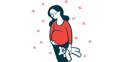 A pregnant woman holds a teddy bear with one hand while cradling her belly with the other.