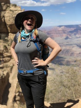 planning | Cystic Fibrosis News Today | Jenny Humphries smiles while standing on a trail that appears to be at the Grand Canyon in the U.S. She's wearing western-style hiking gear.