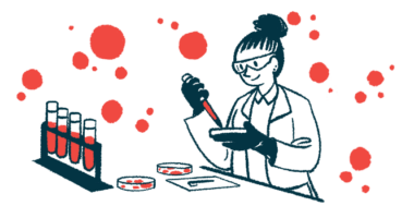 A scientist in a laboratory is shown testing samples from a set of vials using a petri dish and dropper.