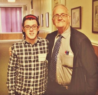 jesuit education | Cystic Fibrosis News Today | a photo of Father Azzarto with his arm around young William. William is in a plaid shirt and wears glasses; the father is in a coat and tie.