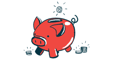 A coin is poised over the money slot of a pig-shaped piggy bank.