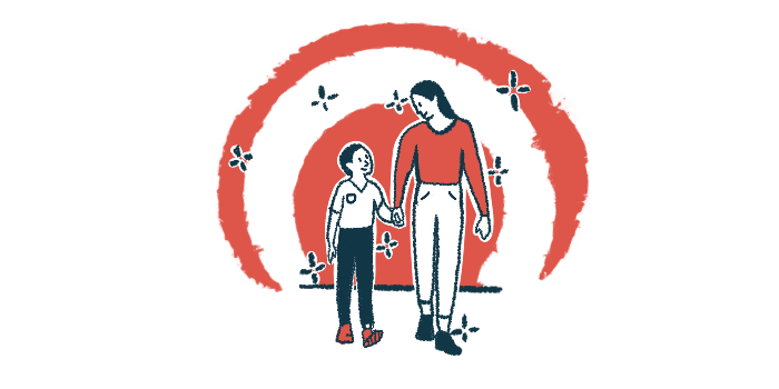A mother and young son walk hand in hand in front of a rising sun.