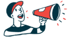 A person in a baseball cap speaks using a megaphone.