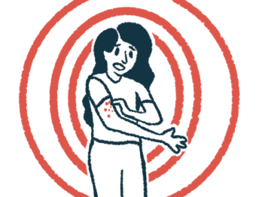 A woman scratches at a rash on her arm.