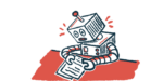 A robot sits at a desk looking at a paper.